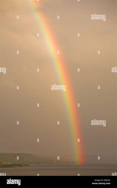 Rainbow Over Lake Stock Photo Alamy