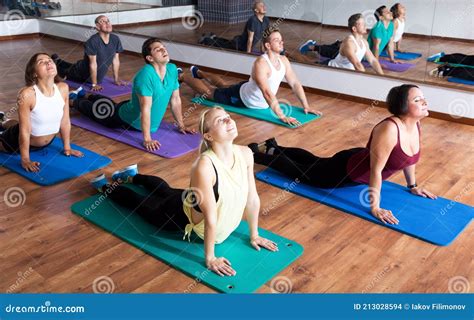 Adults Having Yoga Class In Sport Club Stock Photo Image Of Enjoying