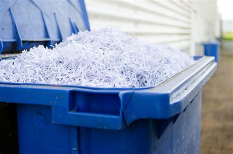 Blue Whelie Bin Full Of Shredded Paper Global Document Services Llc