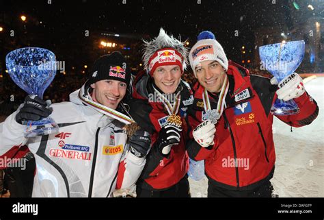 Austria S Gold Medal Winner Thomas Morgenstern C Is Flanked By His Compatriot Silver Medal