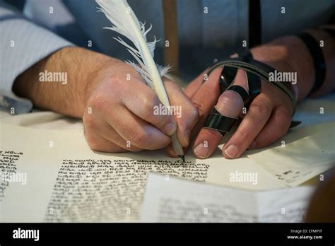 A Jewish Scribe Known As A Sopher Writing Hebrew Letters Onto Parchment