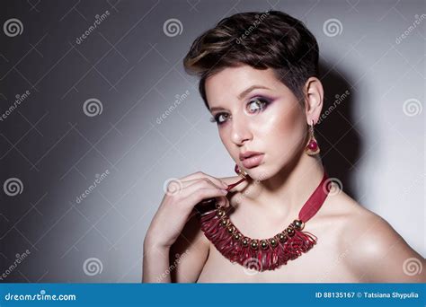 Beautiful Sensual Young Girl With Short Hair With Bright Makeup In The