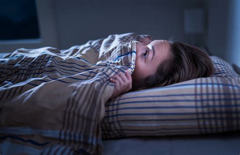 Scared Woman Hiding Under Blanket Afraid Of The Dark Unable To Sleep