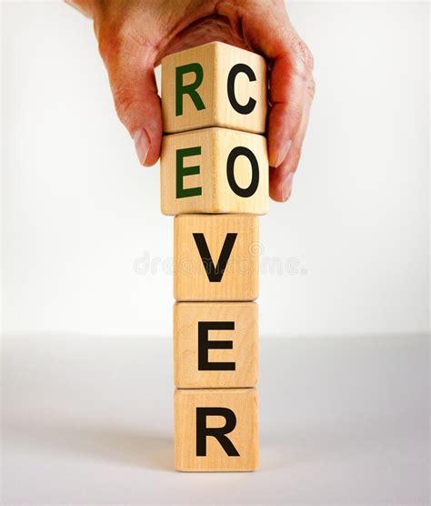 Time To Recover Symbol The Word `recover` On Wooden Cubes Male Hand