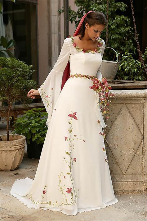 A Woman In A White Wedding Dress Standing Next To A Potted Plant
