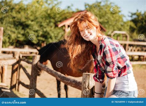 Smiling Woman Cowgirl Sitting On Fence In Village Stock Image Image