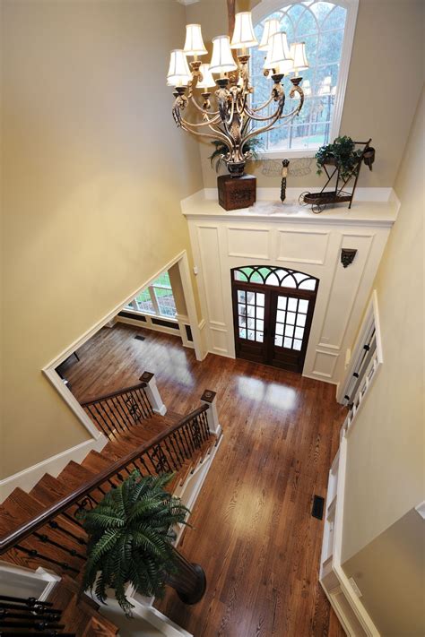 A View Of The Above Foyer From The Top Of The Staircase Landing