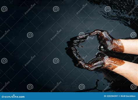 Caucasian Oil Hands Are Folded In A Bowl Of Oil Oil Spill