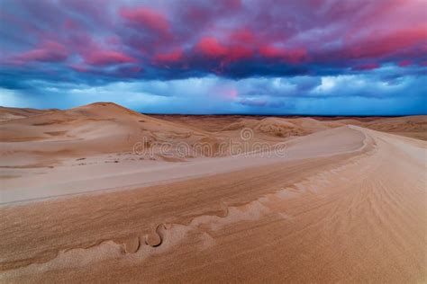 Dramatic Sunset Over Sand Dunes In The Desert Stock Image Image Of