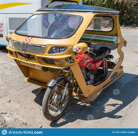 yellow motor tricycle taxi in puerto princesa palawan philippines editorial photo