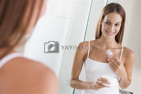 Woman In Bathroom Applying Lotion Smiling Royalty Free Stock Image Stock Photos Royalty Free