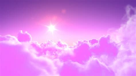 Pink And White Clouds Blow Through A Pretty Blue Sky Stock Footage