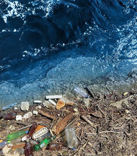 Spilled Garbage On The Beachempty Used Plastic Bottle Stock Image