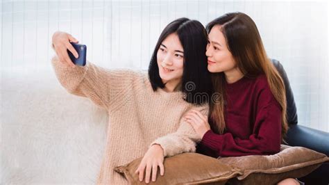 Young Beautiful Asian Women Lesbian Couple Lover Reading Book And