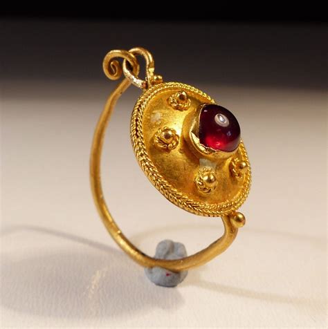 Roman Gold Earring Set With A Cabachon Garnet Dating To The 2nd 3rd Century Ad Roman Jewelry