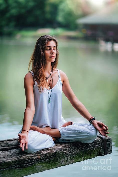 Woman Meditating By A Lake Photograph By Microgen Images Science Photo Library Pixels
