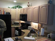 What wall color will not make the cabinets look more pink? I have pickled oak cabinets and want to paint my walls ...