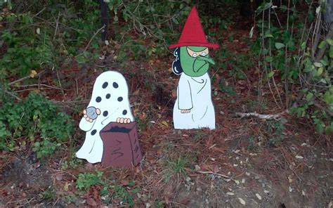 Charlie Brown In His Ghost Costume And Lucy In Her Witch Costume Trick