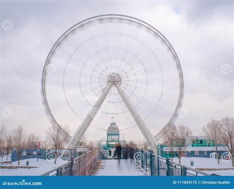 Long Exposure Shot Of A Ferris Wheel In The Middle Of A Winter Day