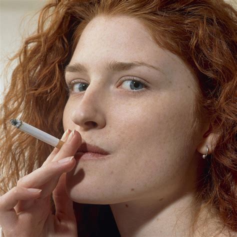 Close Up Of A Woman Smoking A Cigarette Photograph By Damien Lovegrove