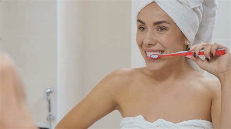 Woman Brushes Her Teeth In The Bathroom Stock Video Footage 00 08 SBV