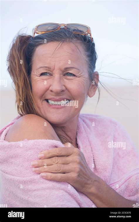 Portrait Attractive Mature Woman Outdoor With Pink Towel Over Shoulder Relaxed Happy Smiling