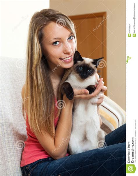 Girl With A Siamese Cat In The Room Stock Photo Image Of Haired