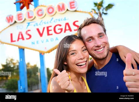 Las Vegas Couple Happy And Excited At Welcome To Fabulous Las Vegas Sign Billboard At The Strip