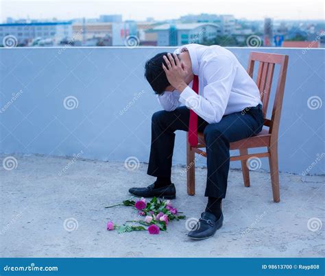 A Disheartened Man In A Suit Broken Hearted After Being Rejected