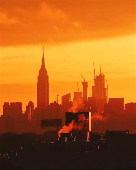 A Striking Orange Sunset Over Manhattan New York Pictures Modern