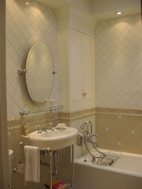 The countertop is one block of marble with a large vein running through it. 30 Bathroom tile designs on a budget 2020