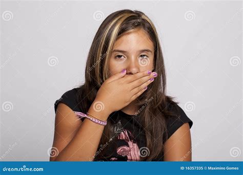 girl with hand over her mouth stock image image of attractive beautiful 16357335