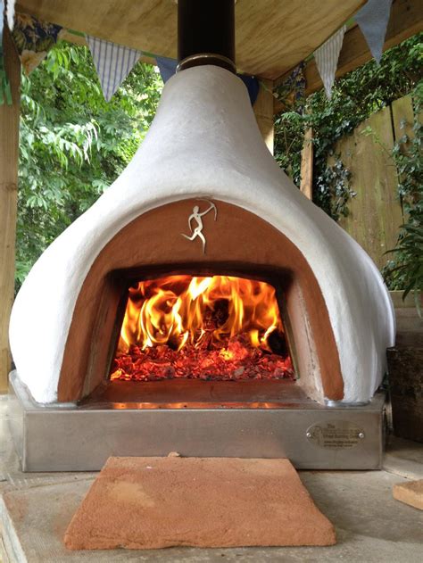 This fireplace has a barbecue grill hidden behind the sunburst. Wood Fired Pizza Ovens, Dome Homes,Chimineas From Dingley Dell Enterprises - Medium uninsulated ...
