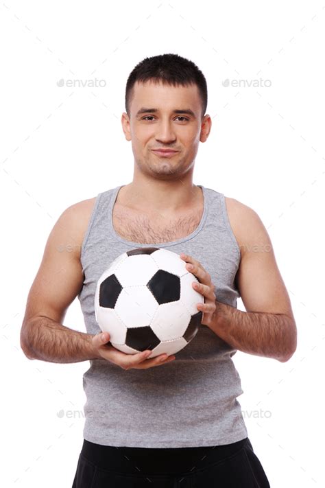 Attractive Guy Holding Soccer Ball Stock Photo By Vecphostudio Photodune