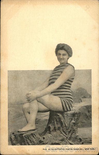 Woman In Striped Bathing Suit Sitting On Stump Swimsuits And Pinup