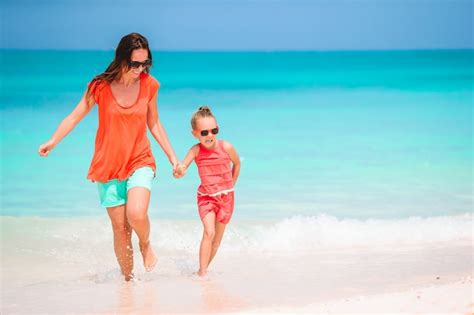 Premium Photo Beautiful Mother And Daughter At Caribbean Beach Enjoying Summer Vacation