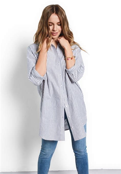 model wears our oversized striped shirt with metallic embellished stripes in blue and white