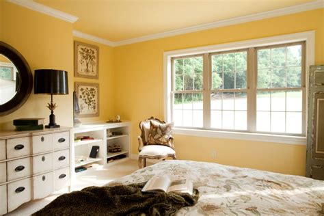 Transitional homes have a great mix of it's one of our favorite master bedroom design ideas. Master bedroom with crown molding, a bright yellow wall ...