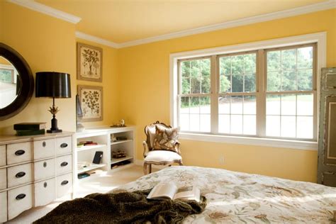 How to paint a sunset on a bedroom wall. Master bedroom with crown molding, a bright yellow wall ...