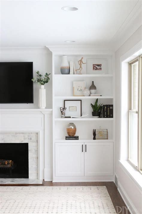 White Built Ins Around The Fireplace Before And After The Diy