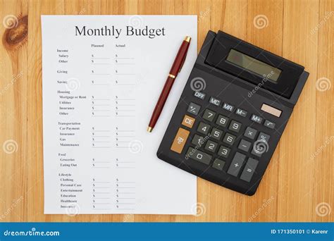 Creating Your Monthly Budget With A Calculator And Pen Stock Image