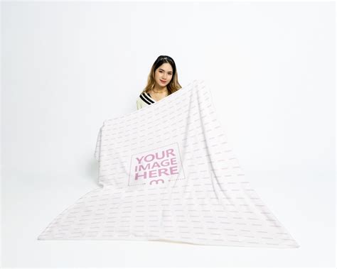 Mockup Of A Blanket Held By A Young Woman Mediamodifier