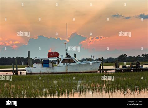 A Crab Boat Tied Up To The Crosby Dock At Sunset In Folly Beach Sc