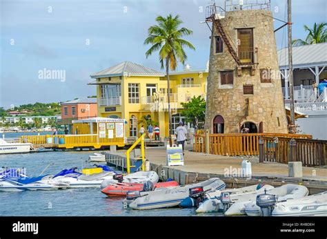 Christiansted Harbor Boardwalk With Sugar Mill Restaurant And Boats
