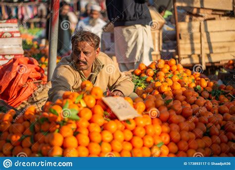 A Seller Is Waiting For Customers In The Vegetable Market To Editorial
