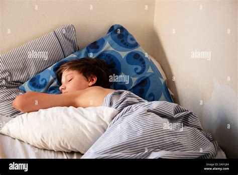 Boy Sleeping In Bed Stock Photo Alamy