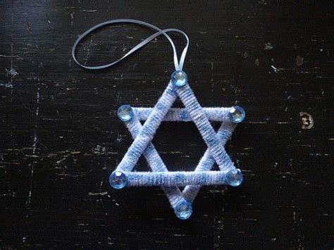 The Star Of David Is Made Out Of Blue Thread And Glass Bead Beads On