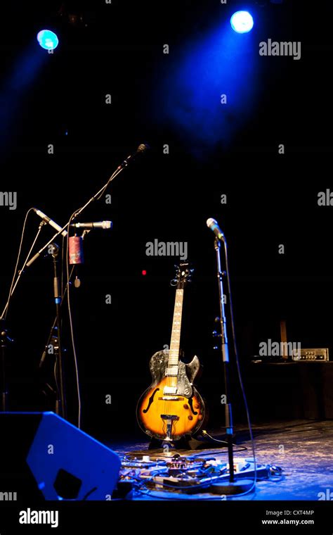 Guitar On Stage With Spotlights Stock Photo Alamy