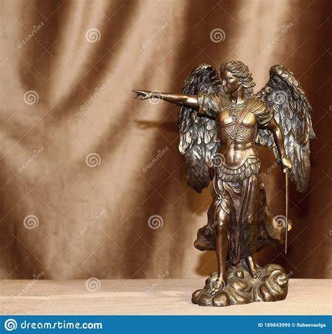 Statuette Of The Archangel Michael On A Velour Background Stock Photo