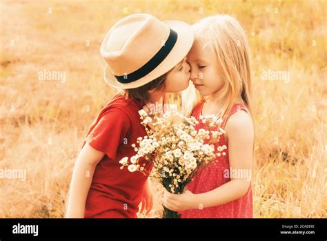 Happy Lovely Kids Kiss On Autumn Field Cute Little Children Kissing